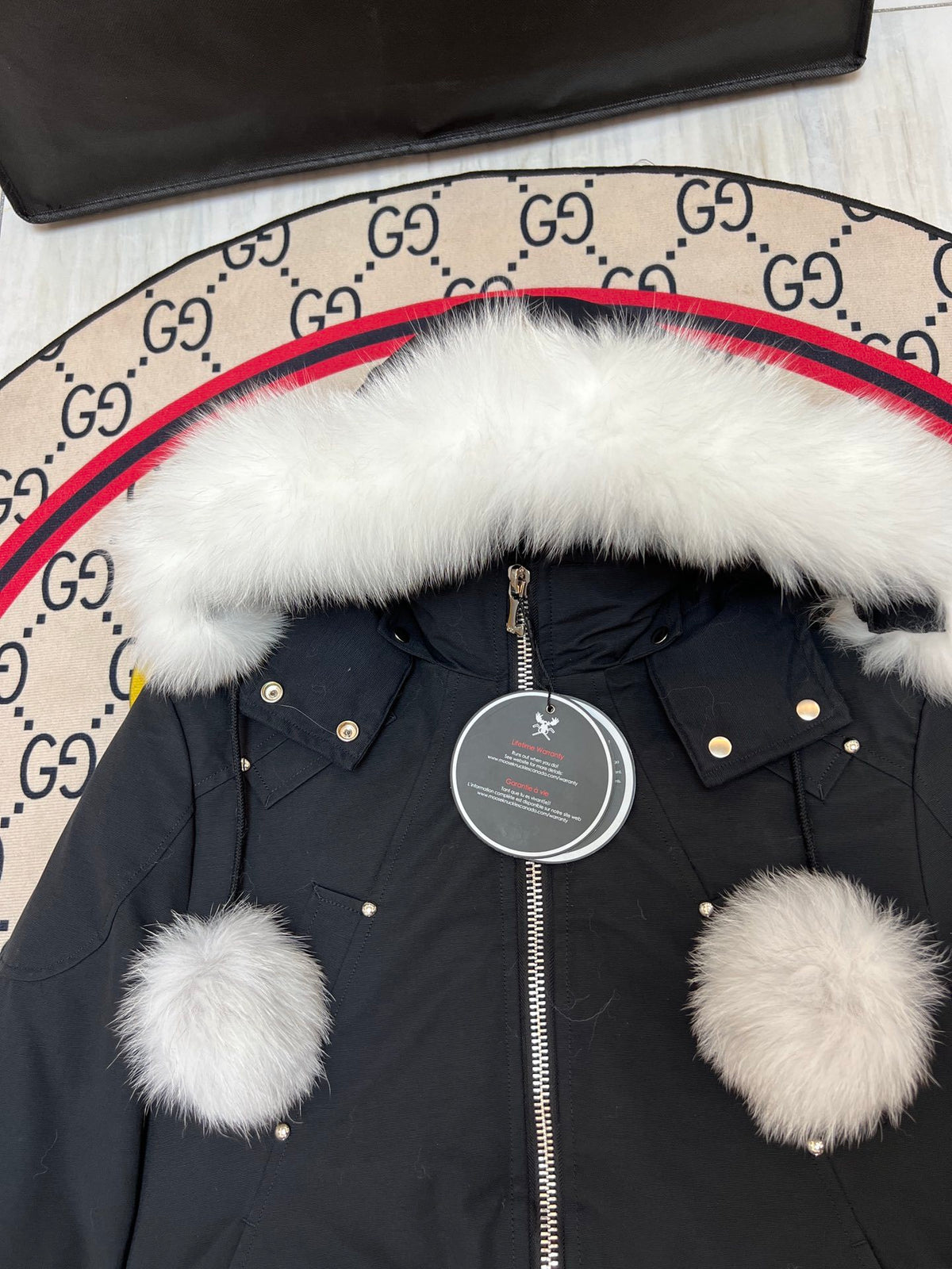 Moose Knuckles Black Hooded Bomber Jacket with Plush Pom-Poms