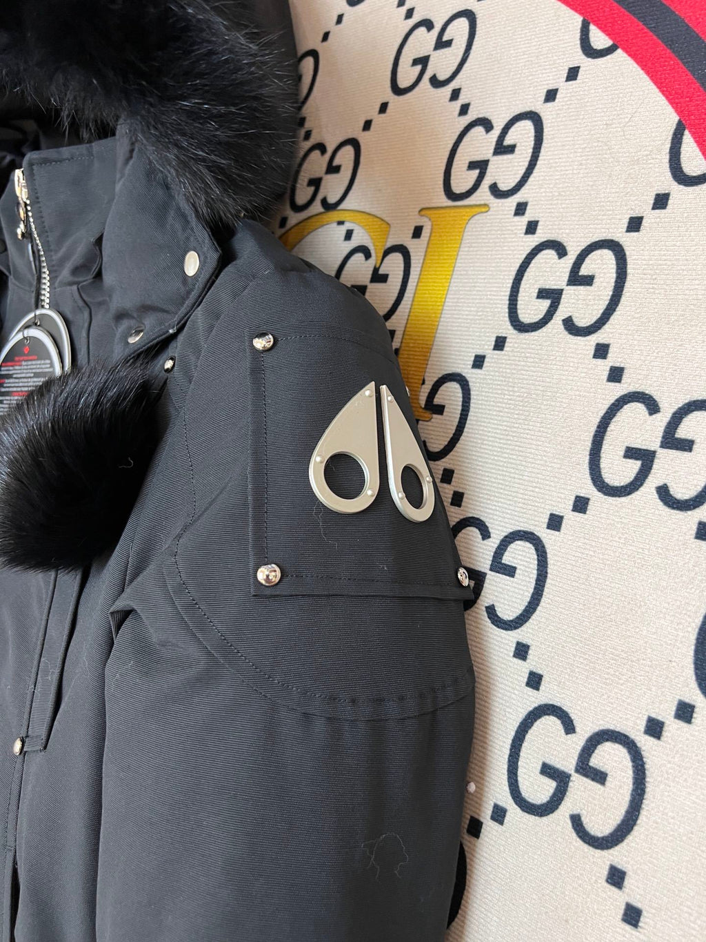 Moose Knuckles Black Hooded Bomber Jacket with Plush Pom-Poms