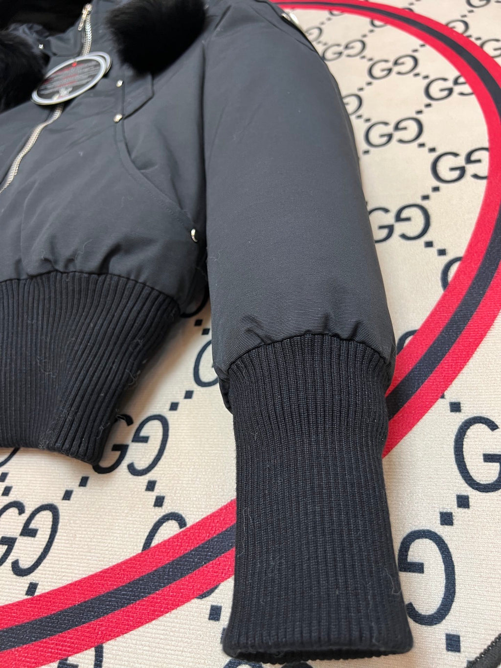Moose Knuckles Black Hooded Bomber Jacket with Plush Pom-Poms