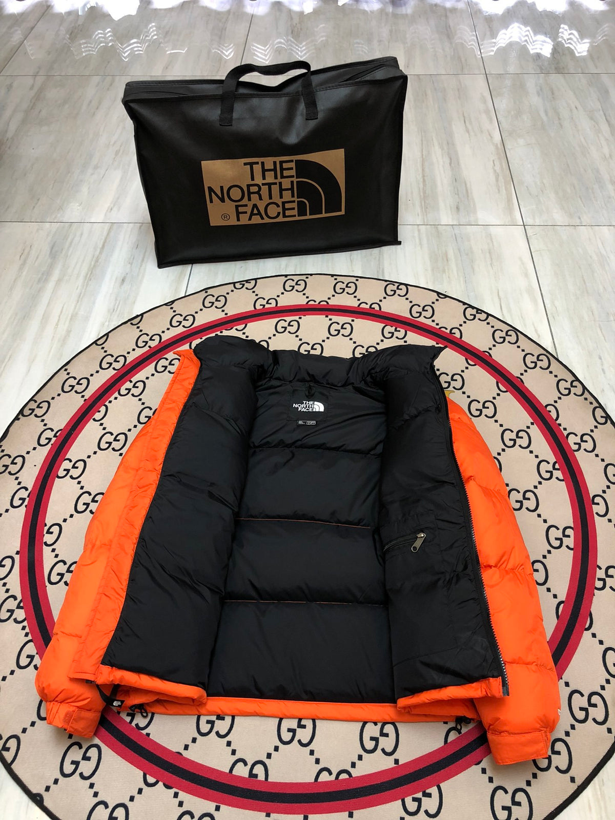 The North Face Orange and Black Colorblock Puffer Jacket